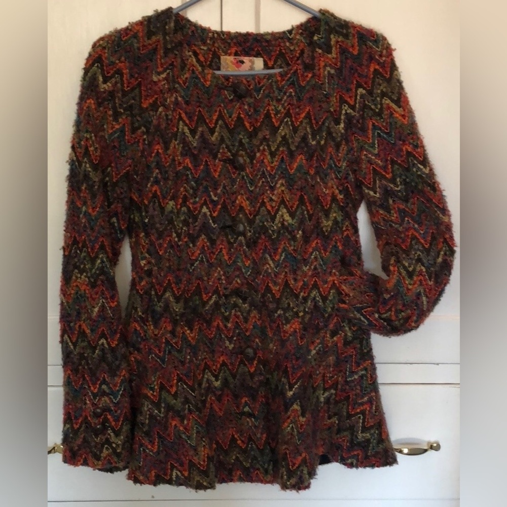 Free People’s flared, hip lengthed, lined jacket size small.